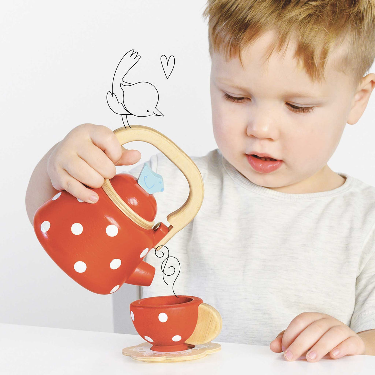 TV312-dotty-kettle-boy-pouring-a-cup-of-hot-drink